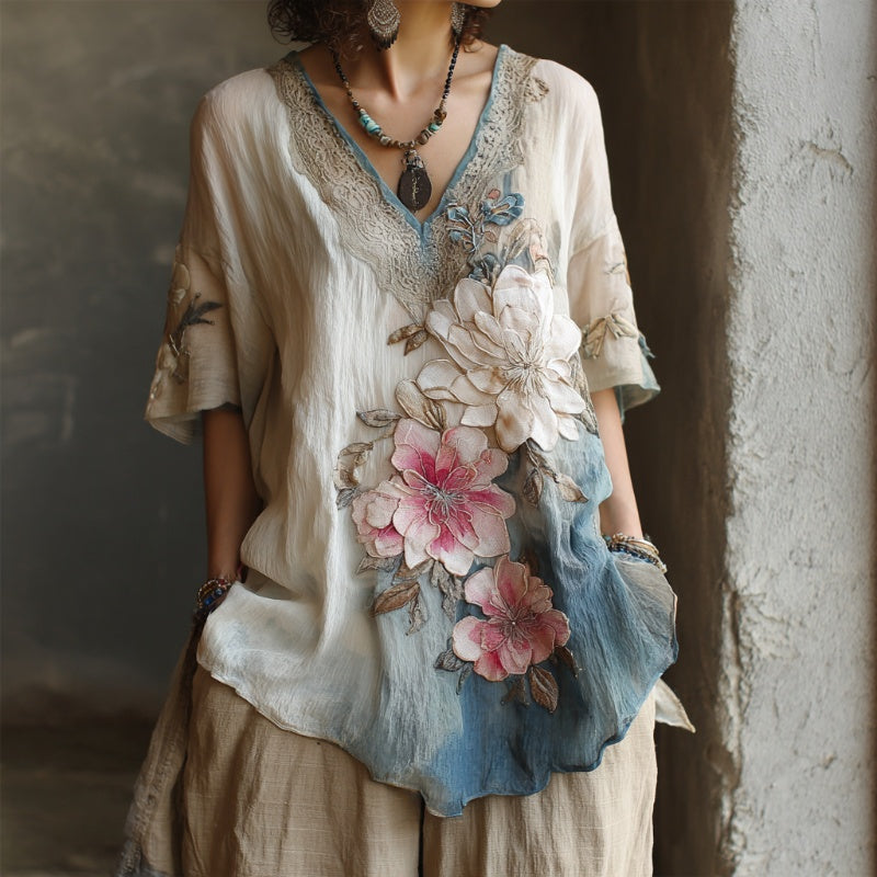 Mély V-nyakú blúz virágmintával